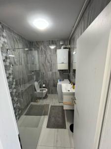 a bathroom with a sink and a toilet at Sweet yellow in Zagreb