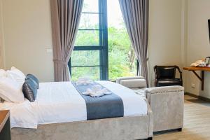 Phuping Valley Resort客房内的一张或多张床位