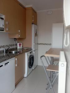 Η κουζίνα ή μικρή κουζίνα στο Duplex con piscina VUT1230AS