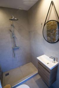 a bathroom with a sink and a mirror at Villa Marina Limnos in Pedhinón