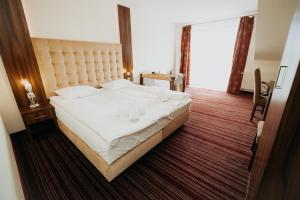 Łóżko lub łóżka w pokoju w obiekcie Noclegi - Apartamenty Żołynianka