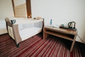 Łóżko lub łóżka w pokoju w obiekcie Noclegi - Apartamenty Żołynianka
