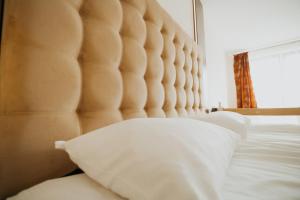 Łóżko lub łóżka w pokoju w obiekcie Noclegi - Apartamenty Żołynianka