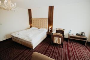Łóżko lub łóżka w pokoju w obiekcie Noclegi - Apartamenty Żołynianka