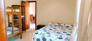 Ένα ή περισσότερα κρεβάτια σε δωμάτιο στο Casa Brisa da Terra.