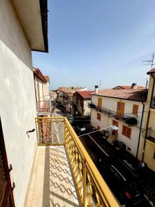 a balcony of a building with a view of a street at La casina di Irene in Villalfonsina