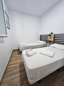 Posteľ alebo postele v izbe v ubytovaní Planeta Cádiz Apartaments