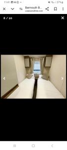 Ένα ή περισσότερα κρεβάτια σε δωμάτιο στο Barmouthbay209