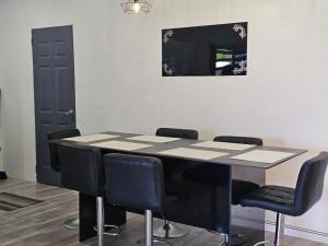 a conference room with a table and chairs at Moutain View Villa in Pacific Harbour