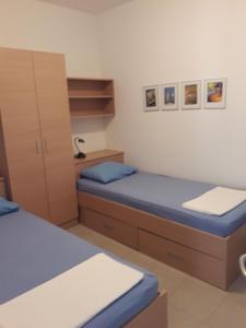 Posteľ alebo postele v izbe v ubytovaní Apartments Paska Preko