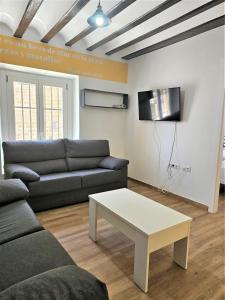 Televízia a/alebo spoločenská miestnosť v ubytovaní Planeta Cádiz Apartaments