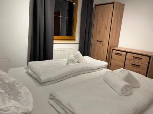 Postel nebo postele na pokoji v ubytování Bergauszeit-Gappmair
