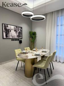 a dining room with a table and chairs at Kease Malqa D-12 Royal Touch GZ20 in Riyadh