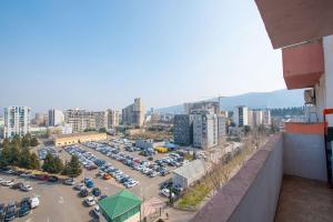 an aerial view of a parking lot with cars at GG Home - 1-Bedroom apartment in Saburtalo near metro in Tbilisi City