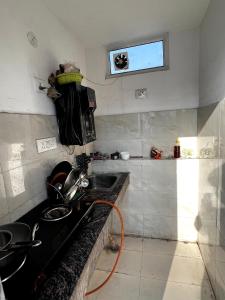 a kitchen with a sink and a counter top at Hotel Trending Stay in New Delhi