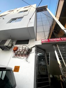 a building with a sign that reads house renting services at Hotel Trending Stay in New Delhi