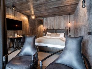Кровать или кровати в номере Hotel Tirolerhof 4 Sterne Superior