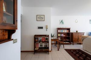 a living room with a couch and a table at Revo Apartments - Quadrifoglio in Sondrio