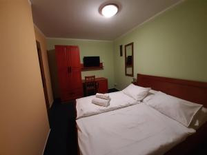 Postel nebo postele na pokoji v ubytování Penzion Planicka