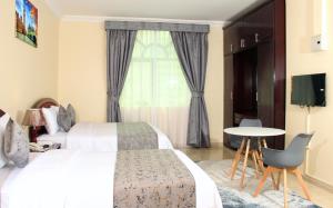 Postel nebo postele na pokoji v ubytování Al BARAKAH HOTEL
