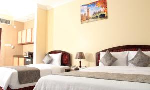 Postel nebo postele na pokoji v ubytování Al BARAKAH HOTEL