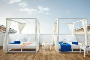 Кровать или кровати в номере Hotel Villa Flamenca