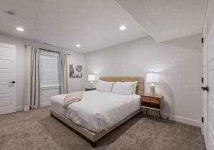 a white bedroom with a large bed and a window at Alpine Adventure Getaway - Heber City - Jordanelle State Park in Heber City