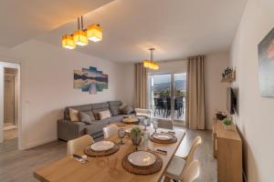 a living room with a table and a couch at RentitSpain - Playa Granada - Apartamento Aguacate Golf y Costa in Motril