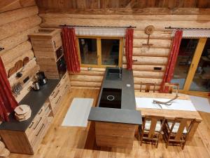 an overhead view of a kitchen in a log cabin at Ferienhaus - Chalet - Lechtraum in Stanzach