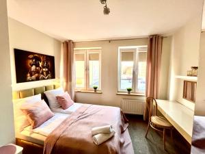 Posteľ alebo postele v izbe v ubytovaní Apartament Kameralny nad Motławą