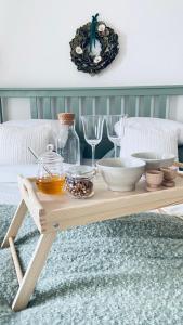 a wooden coffee table with bowls and glasses on a couch at Sebuzínka in Ústí nad Labem