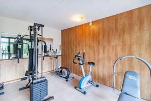 a gym with several exercise bikes in a room at Villa Paola Private Pool Gym in Chianti - Happy Rentals in Montespertoli