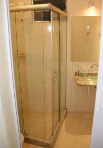 a glass shower in a bathroom with a sink at Hostel Vista do Mar in Rio de Janeiro
