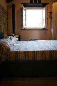 Llit o llits en una habitació de La casina-Maisonette