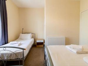 Ένα ή περισσότερα κρεβάτια σε δωμάτιο στο Pass the Keys Comfortable townhouse a few miles from Durham City