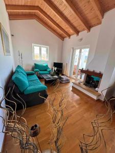 a living room with a couch and a table at LOFT HOUSE in Vrachati