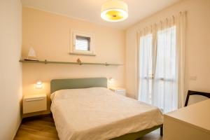 Postel nebo postele na pokoji v ubytování Casa Sestini