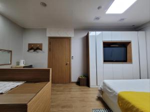 Residence Yeoyu客房内的一张或多张床位
