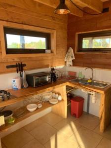a kitchen with a sink and a counter top at Cabaña con hermosa vista in Ancud