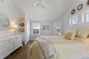 a white bedroom with a large bed and a dresser at 7011 Pacific Ave in Wildwood Crest +32 photos