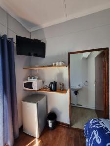 Kuchyň nebo kuchyňský kout v ubytování Courageous Self Catering Accommodation + 30 fotografií