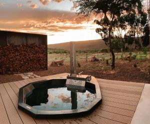 a hot tub on top of a wooden deck at Lucky Crane Villas in McGregor