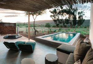a villa with a swimming pool in a yard at Lucky Crane Villas in McGregor