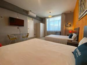 Uma cama ou camas num quarto em Suite Apart Miraflores
