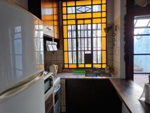 a kitchen with a sink and a window at La Casa de al Lado con Garage !!! in La Plata +10 photos
