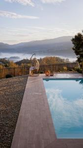 a swimming pool with a view of the mountains at Casas da Madrinha in Arcos de Valdevez
