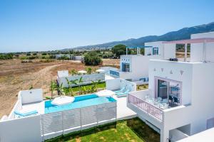 an aerial view of a villa with a swimming pool at Villa Xenos Rose in Tigaki