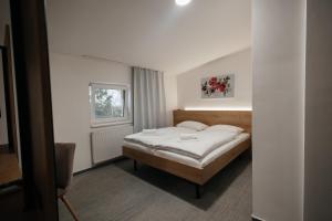 Postel nebo postele na pokoji v ubytování Golden Golem hotel & Spa