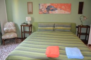 A bed or beds in a room at Green Quercia Apartment