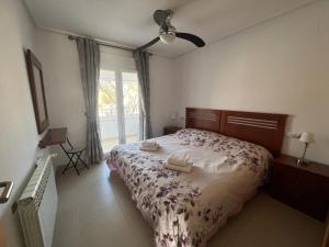 a bedroom with a bed with two towels on it at Pedro’s Apartment in Sucina +40 photos